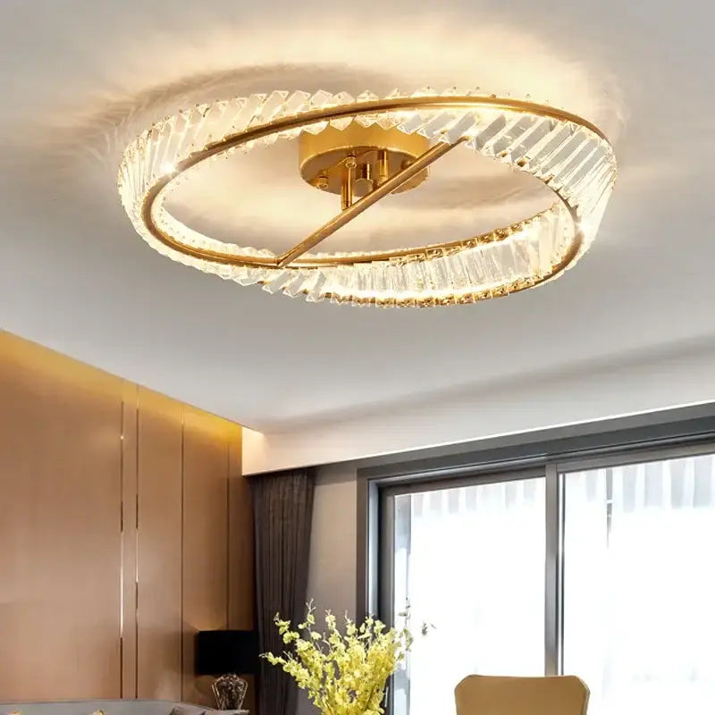 Gold-toned decorbites crystal ceiling lamp with two concentric rings of faceted crystals for modern dining rooms