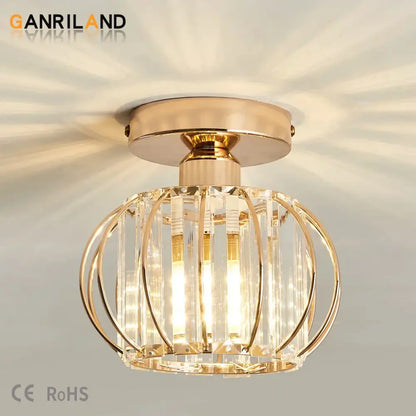Gold-toned decorbites crystal ceiling light with crystal cage design and vertical glass rods for modern interiors