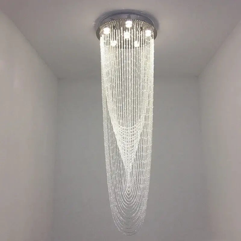 A modern decorbites crystal ceiling light with sleek chrome fixture and cascading clear beads for stairs and living rooms