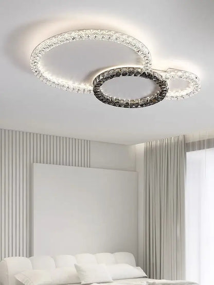 Modern decorbites crystal ceiling led chandelier with two interlocking rings featuring clear and darkened crystals