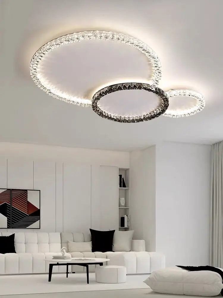 Modern decorbites crystal ceiling light fixture with three interlocking rings in black and clear for indoor luxury lighting