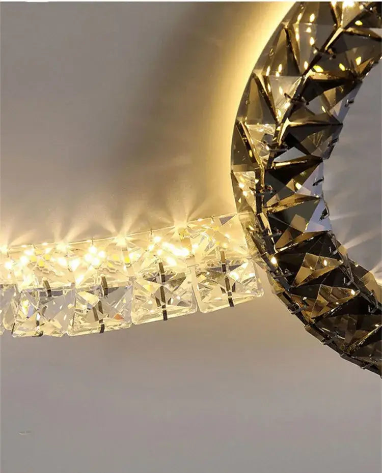 A modern decorbites crystal ceiling led chandelier with faceted crystals and warm light for living room and bedroom