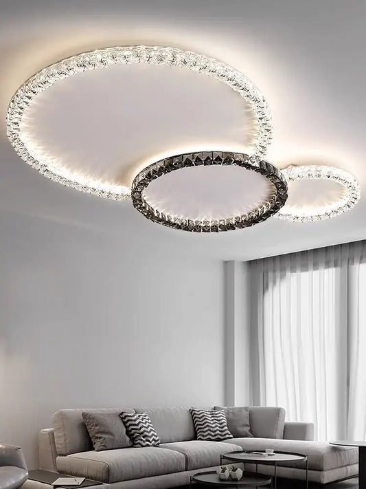 Modern decorbites crystal ceiling light with three interlocking rings adorned with crystals and metallic frame ceiling lights led