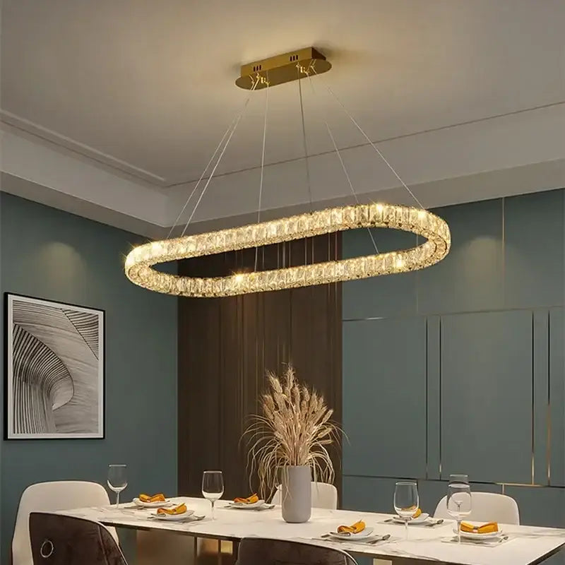 Gold-toned oval decorbites crystal ceiling chandelier with crystal-encrusted design for modern luxury lighting