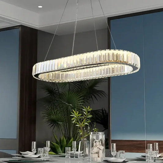 Modern decorbites crystal ceiling pendant chandelier with clear crystal prisms and sleek metallic frame for luxe decor
