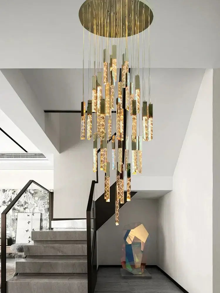 Golden decorbites crystal ceiling pendant lights with cascading etched cylindrical glass elements in an elegant circular design