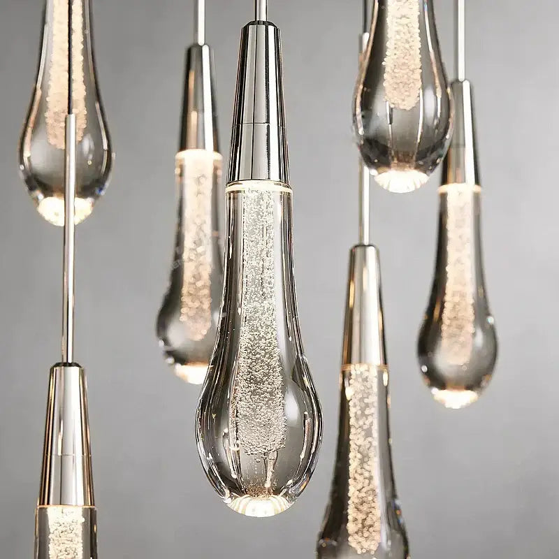 Clear glass teardrop pendant lights with silver caps and led lighting from DecorBites crystal ceiling pendant collection