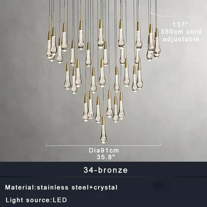 A modern decorbites crystal ceiling pendant light with teardrop crystal pendants and bronze stainless steel cords