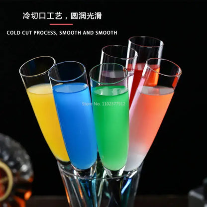 Set of five colorful decorbites crystal champagne wine glasses with smooth rims filled with vibrant liquids for parties
