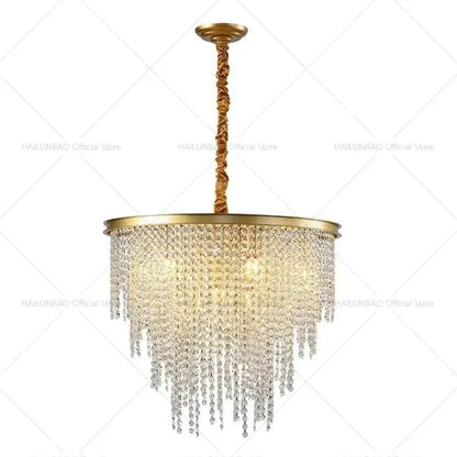 Gold-toned decorbites crystal chandelier with cascading clear crystal beads and twisted brass chain for living room lighting