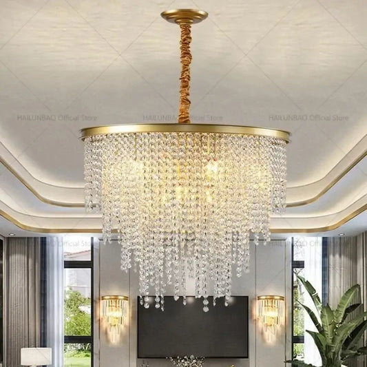 Gold-toned decorbites crystal chandelier with cascading clear crystal droplets for 2024 post-modern living room lighting