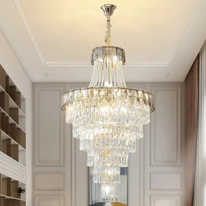 Elegant multi-tiered decorbites crystal chandelier with polished chrome finish and cascading clear crystals for luxury spaces