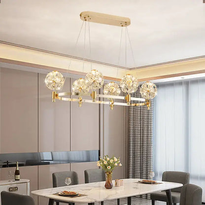 Gold-toned decorbites crystal chandelier with dandelion-like crystal globe pendants for luxe living spaces