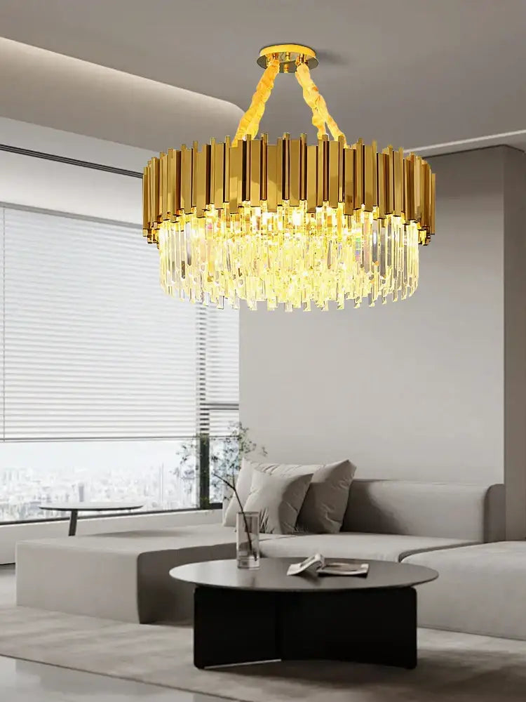 Gold-toned decorbites crystal chandelier with vertical crystal rods and faceted glass elements in stainless steel