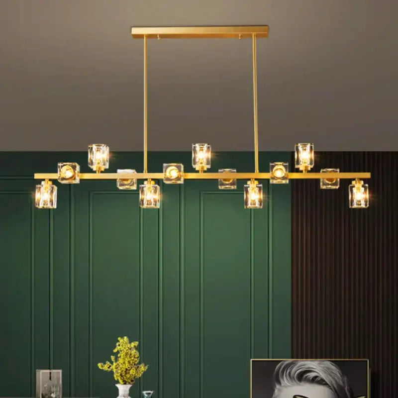 Gold-toned decorbites crystal chandelier with clear glass cube shades and hanging bulbs for living and dining rooms