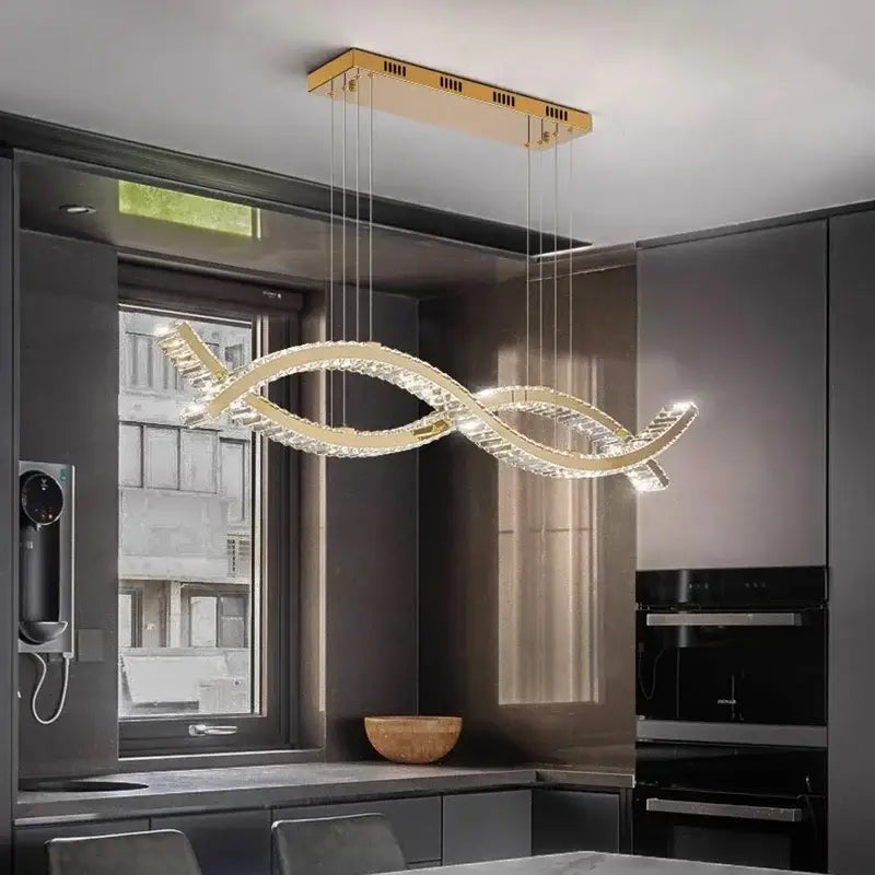 A modern gold-toned decorbites crystal chandelier pendant light with sleek intertwined design for dining and living rooms