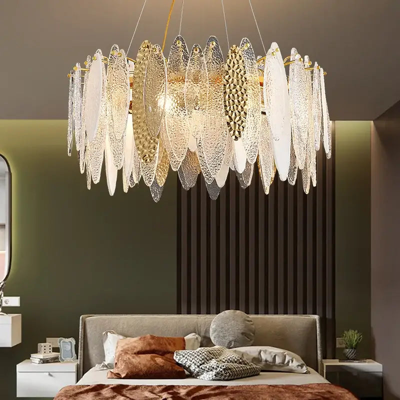 Decorbites crystal chandelier with white and gold translucent leaf-shaped glass panels and brass frame for elegant interiors