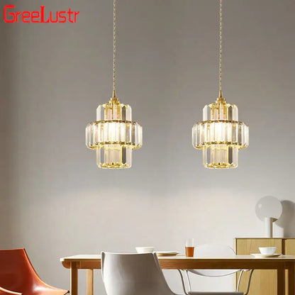 Gold-toned decorbites crystal chandelier with tiered design and hanging chains for elegant living room lighting