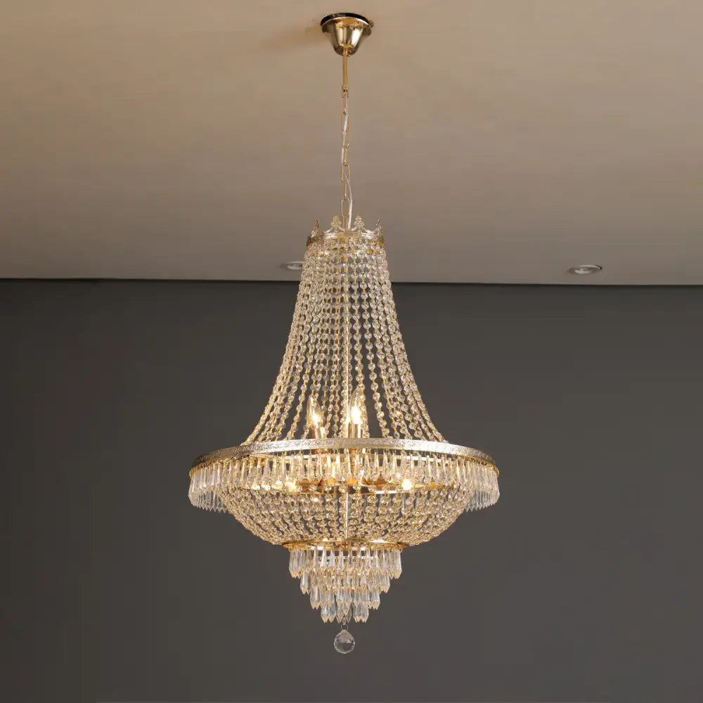 DecorBites crystal chandelier featuring a gold metal frame and cascading clear crystals for luxury living spaces
