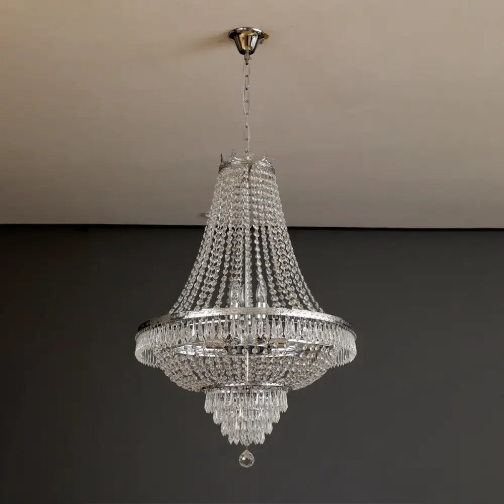 Elegant multi-tiered decorbites crystal chandelier with polished chrome finish and cascading clear crystals for luxury spaces