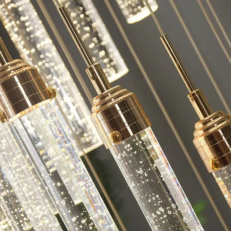 Clear glass decorbites crystal chandelier with gold-toned metal fixtures and internal led lights for deluxe living room decor