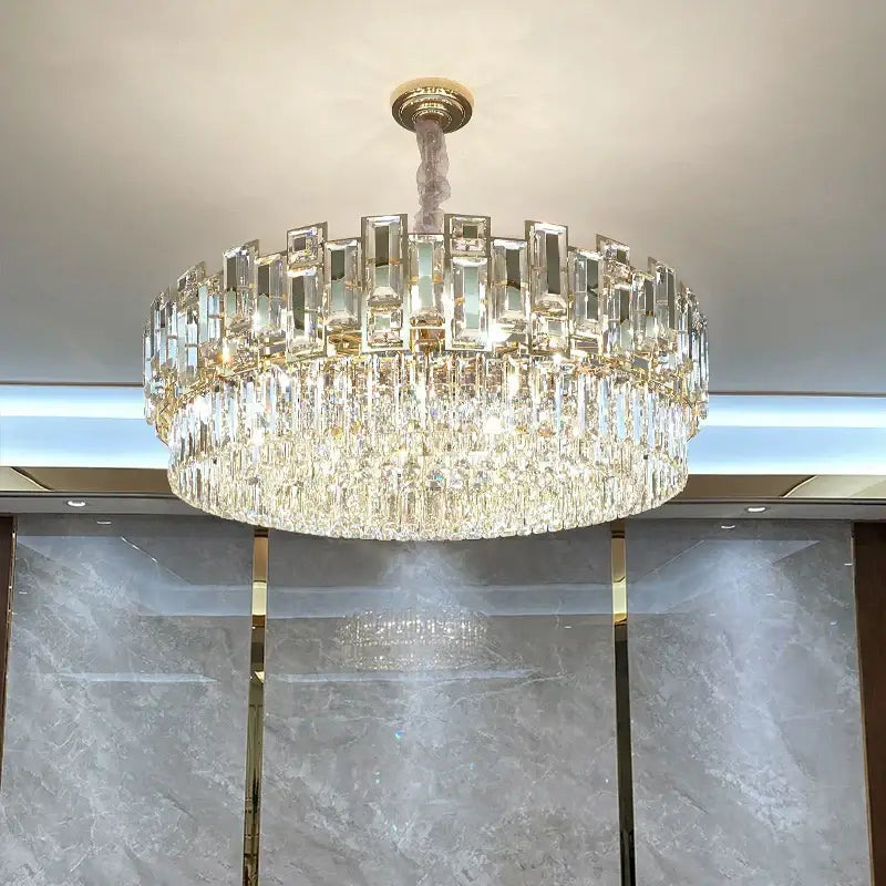 Luxurious two-tiered decorbites crystal chandelier with gold-toned mount and clear prisms ideal for living room lighting