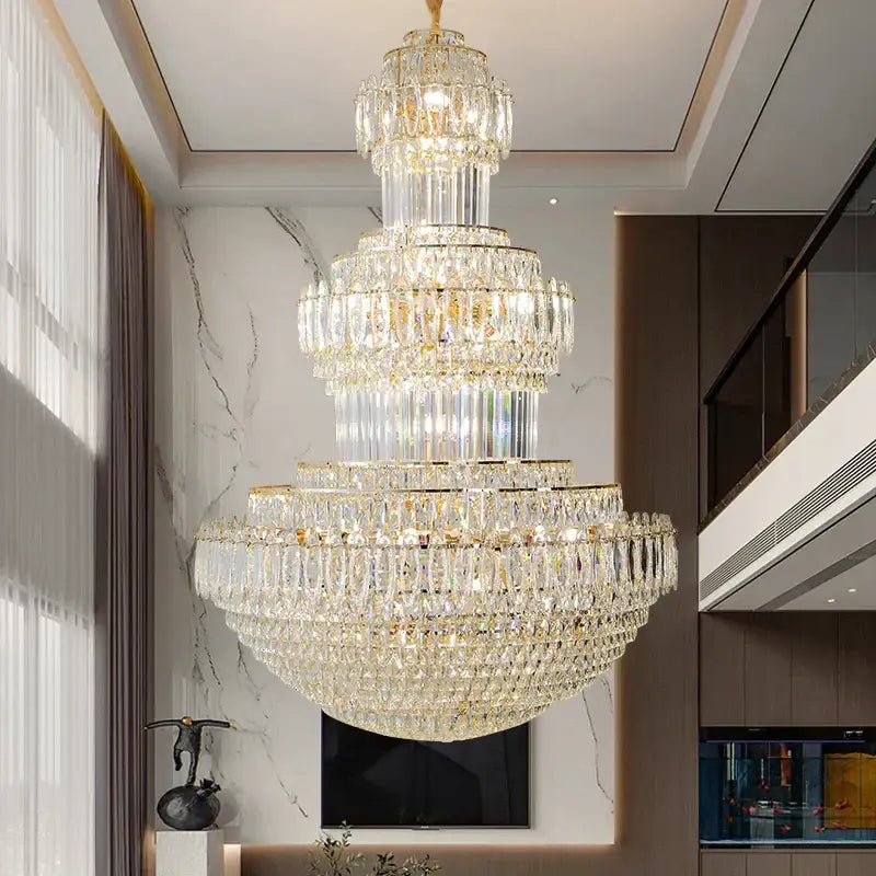 Decorbites crystal chandelier with gold-toned accents and cascading clear crystals for elegant home and hotel lighting