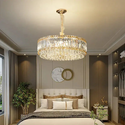 A decorbites crystal chandelier with two-tiered clear faceted crystals and gold-toned accents for elegant lighting