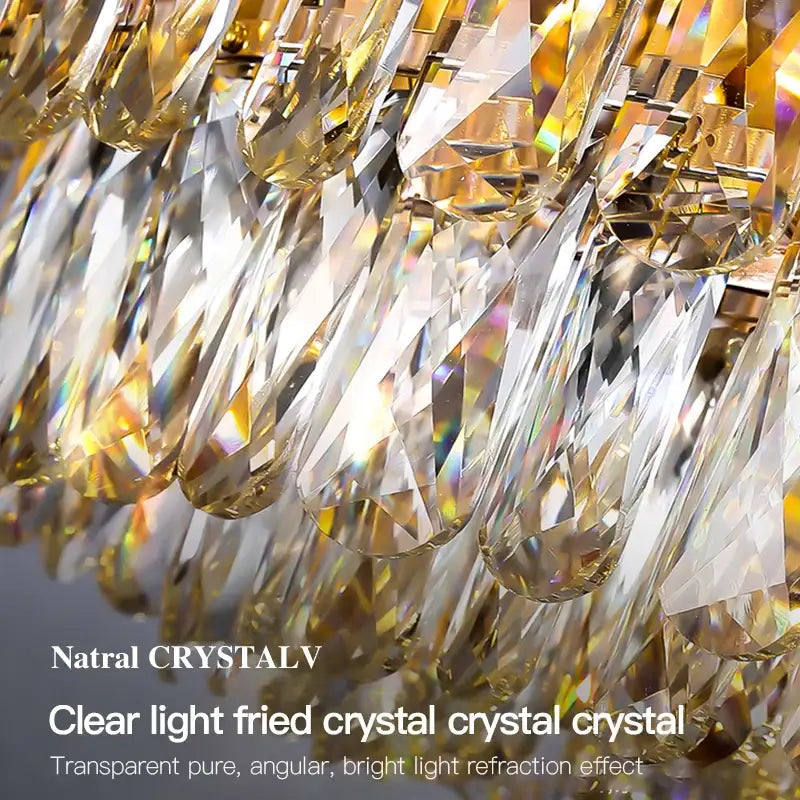 Decorbites crystal chandelier cascading with clear angular crystal droplets refracting golden light for living room lighting