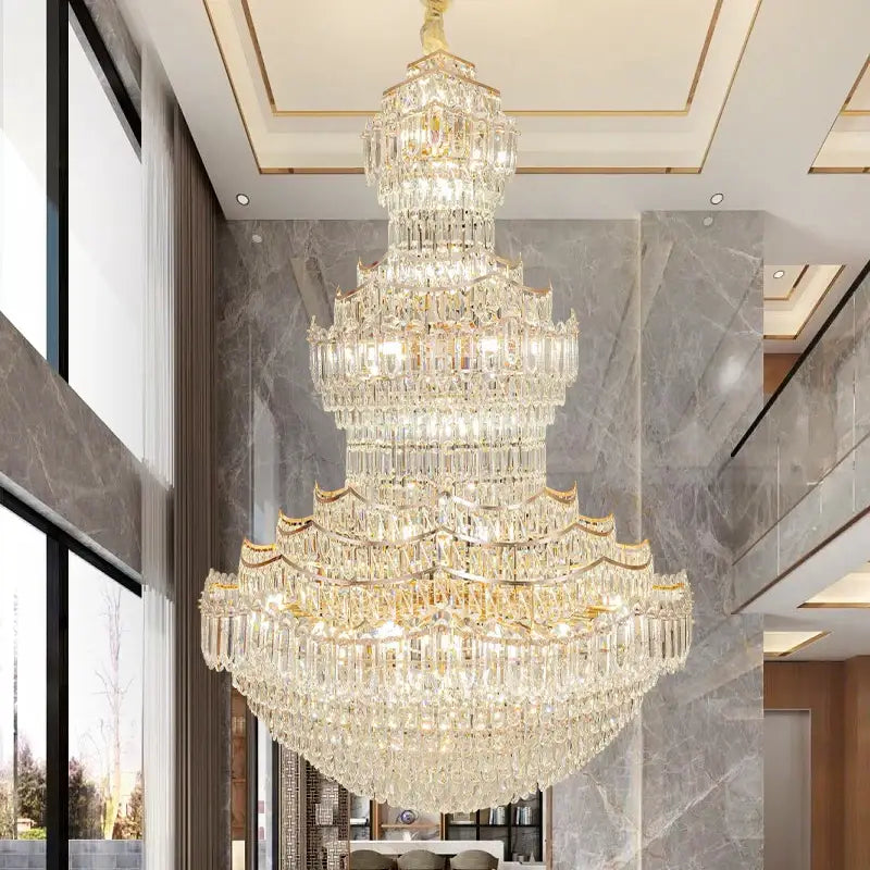 A multi-tiered decorbites crystal chandelier with gold-toned accents and cascading faceted crystals for European villa lobbies