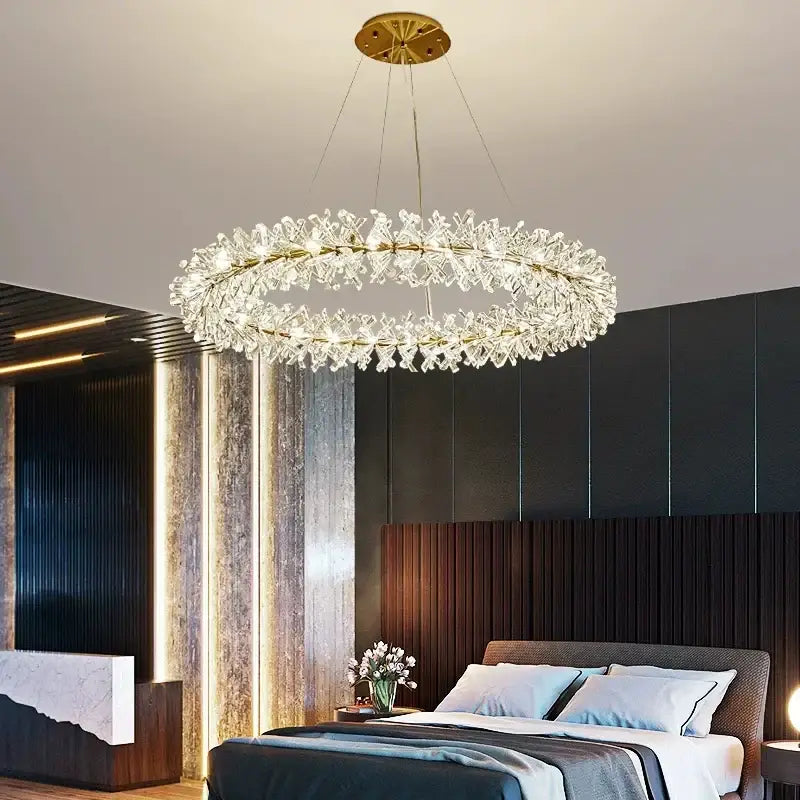 Decorbites crystal chandelier featuring a gold-toned frame and clear faceted crystals in a floral luxury design