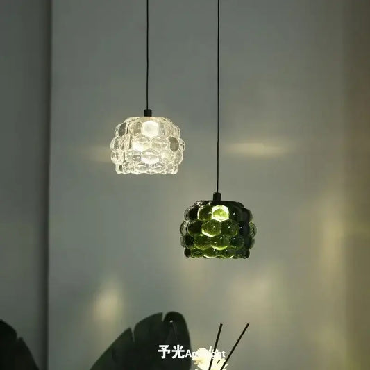 Two pendant lights with clustered bubble glass shades one clear and one emerald green from decorbites crystal chandelier for store cashier area