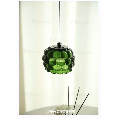 Green glass decorbites crystal chandelier pendant light with textured bubble design for clothing store cashier area