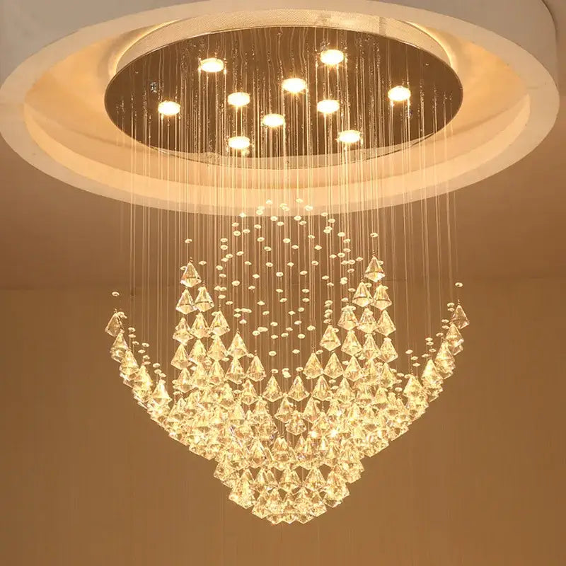 A modern decorbites crystal chandelier with clear faceted crystals and a circular ceiling mount for elegant indoor use