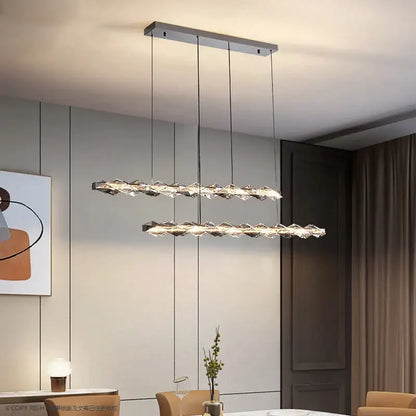 Modern decorbites crystal chandelier with sleek chrome finish and cascading crystal elements for luxury living spaces