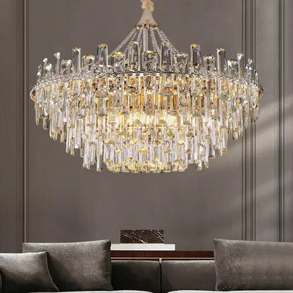 Decorbites crystal chandelier with multi-tiered clear and golden prisms on polished metal for modern luxe interiors