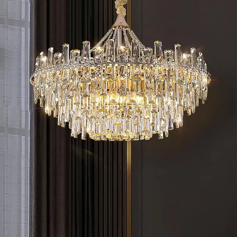Decorbites crystal chandelier with cascading clear and golden prisms on polished gold frame for modern luxe homes