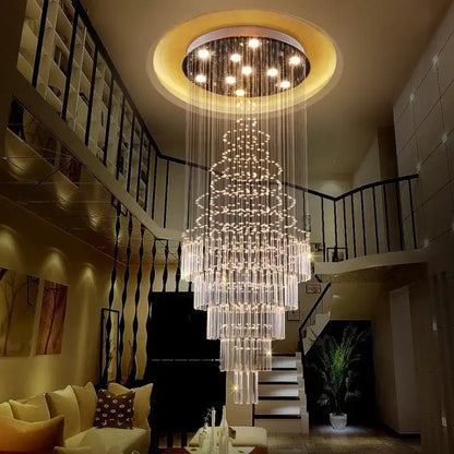 A modern multi-tiered decorbites crystal chandelier with cascading glass rods and embedded lights for staircase use