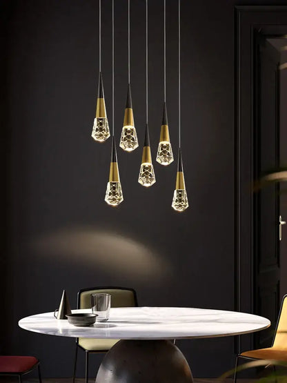 Five gold-accented crystal pendant lights with faceted glass shades for modern living room by DecorBites crystal chandelier
