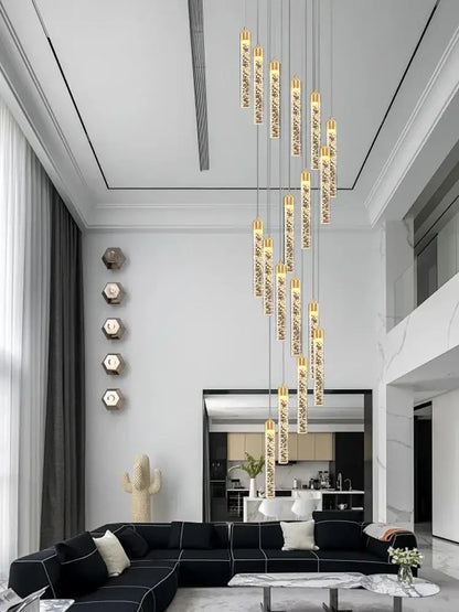A decorbites crystal chandelier featuring vertical glass tubes with sparkling crystals and gold accents for circular stairwell