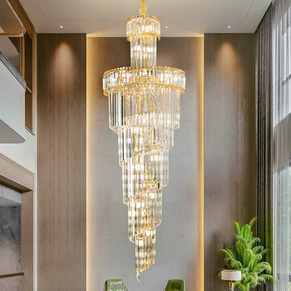 A decorbites crystal chandelier with gold-toned metal and clear glass prisms for dining room living room and master bedroom