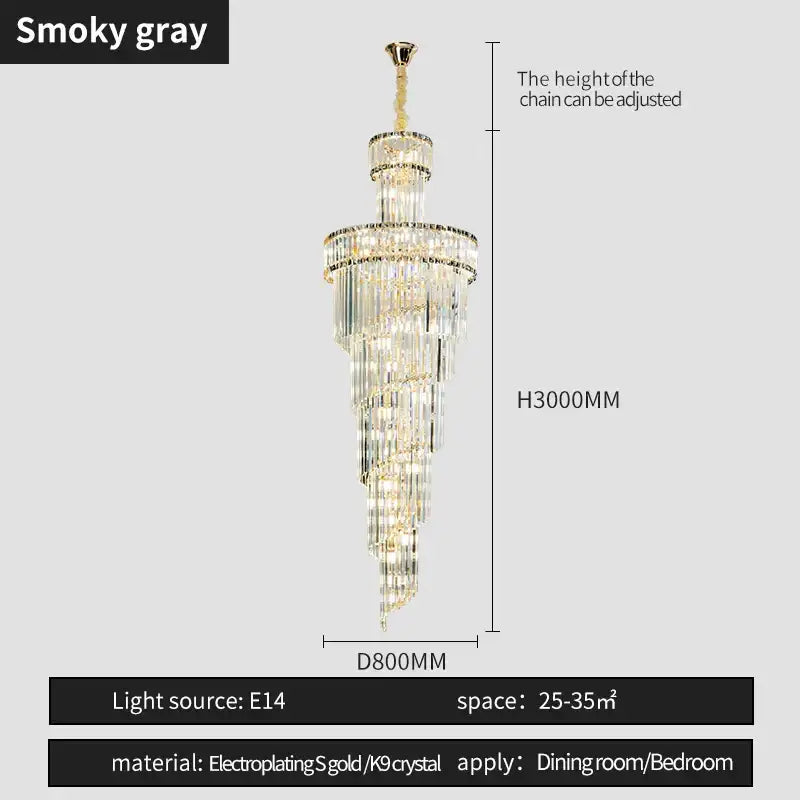 A tall elegant smoky gray decorbites crystal chandelier with cascading clear crystal tiers and gold-plated accents for dining room