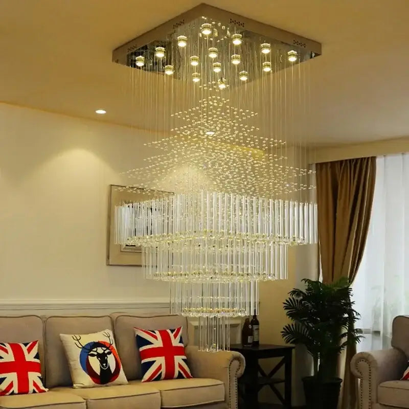 Decorbites crystal chandelier with cascading glass rods and embedded lights suspended from metallic ceiling fixture