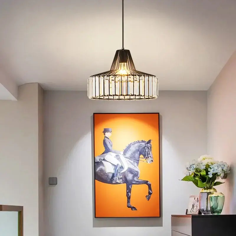 A modern decorbites crystal chandelier pendant light with black metal frame and clear crystal bars for elegant decor
