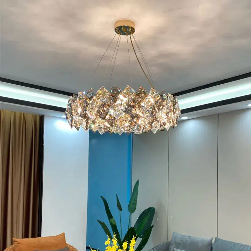 Modern decorbites crystal chandelier with faceted crystal pieces in a circular design for living and dining rooms