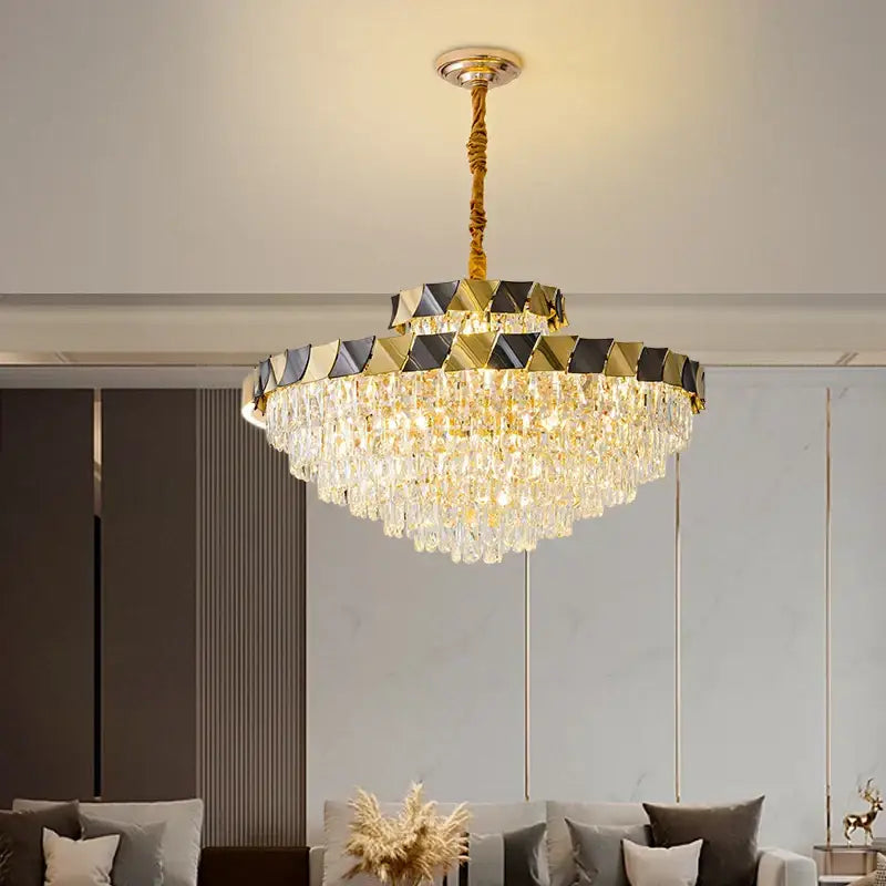 Gold-toned decorbites crystal chandelier with cascading crystal droplets and geometric black and gold frame for luxury lighting
