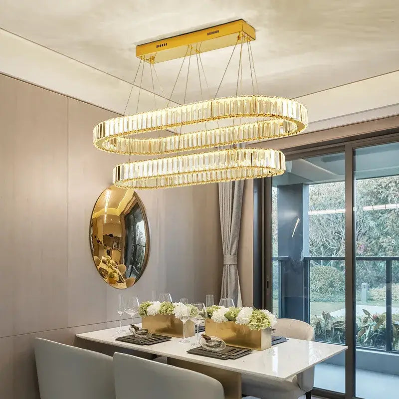 Gold-toned decorbites crystal chandelier with double rings and faceted crystal accents for LED dimmable stair lighting