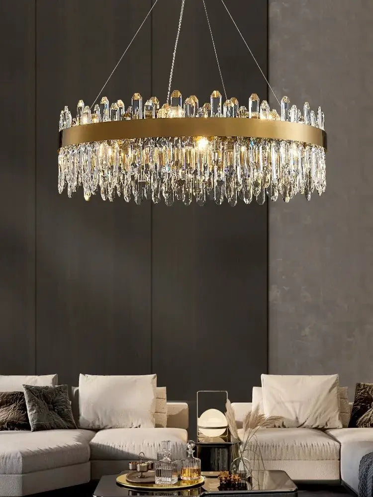 A modern decorbites crystal chandelier led with gold metal frame and clear crystal prisms for dining room use