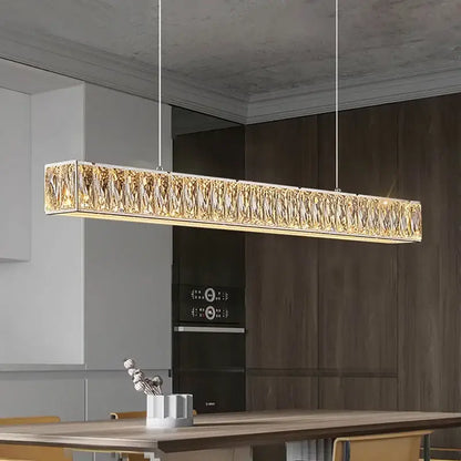 A modern luxury decorbites crystal chandelier led with gold-toned textured crystals and silver metal frame ceiling light