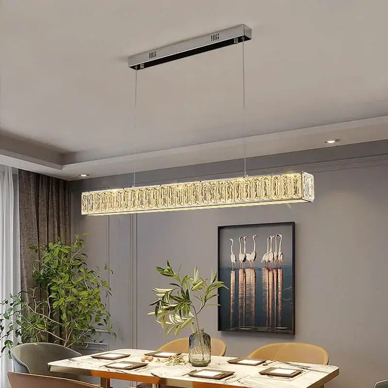 Modern luxury decorbites crystal chandelier led with a sleek silver frame and faceted crystals emitting warm golden light